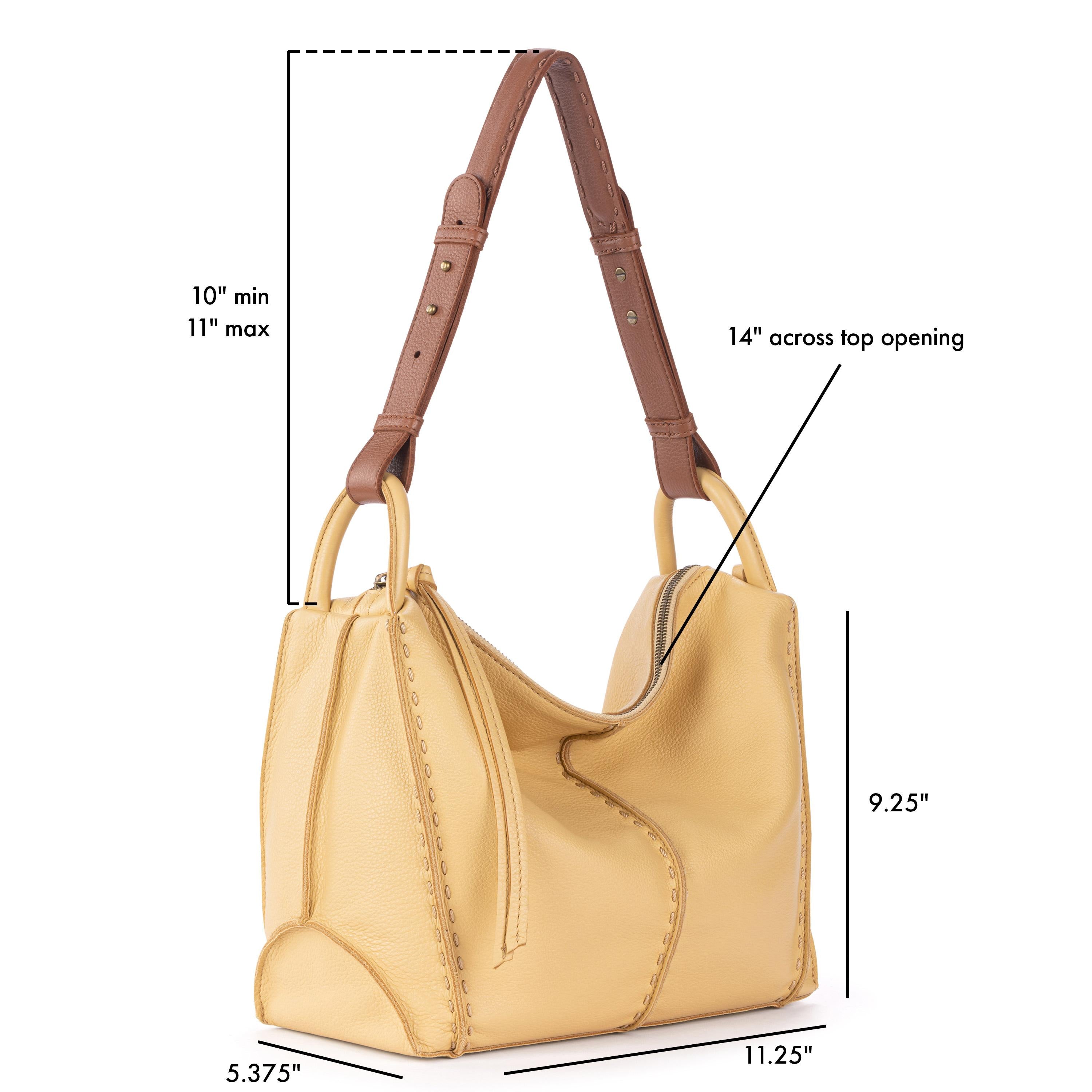 Buttercup leather hobo bag with brown handles, 14" top opening, 9.25" height, adjustable 10-11" shoulder drop.